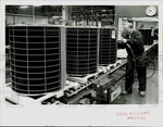1990 Press Photo Bob Walker Working Coleman Central Air Conditioner At Plant. Fixed Price $24.99.